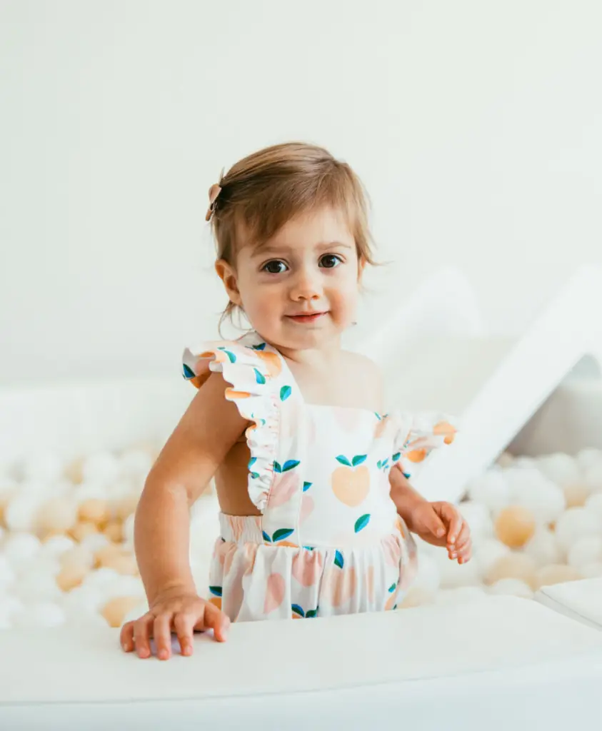 little girl in ball pit